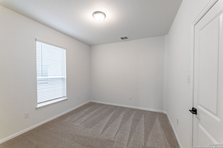 Spacious, unfurnished interior of a new home in The Woodlands at Medina Hills, Mico (Image 10).