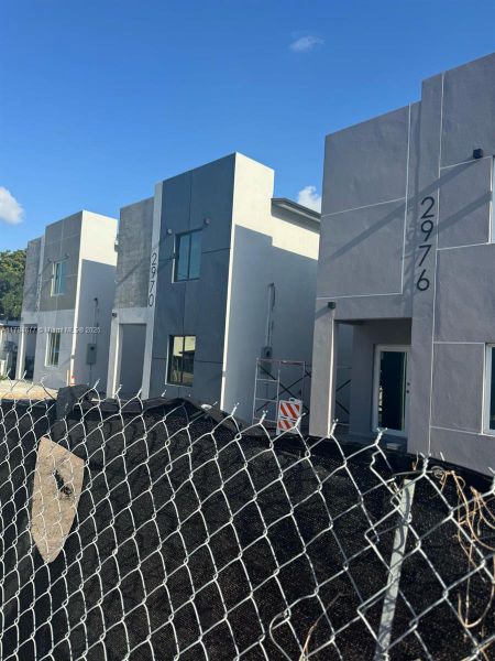 Front exterior of a new home in , Miami, FL, highlighting curb appeal (Image 1). Front exterior of a new home in , Miami, FL, highlighting curb appeal (Image 1).