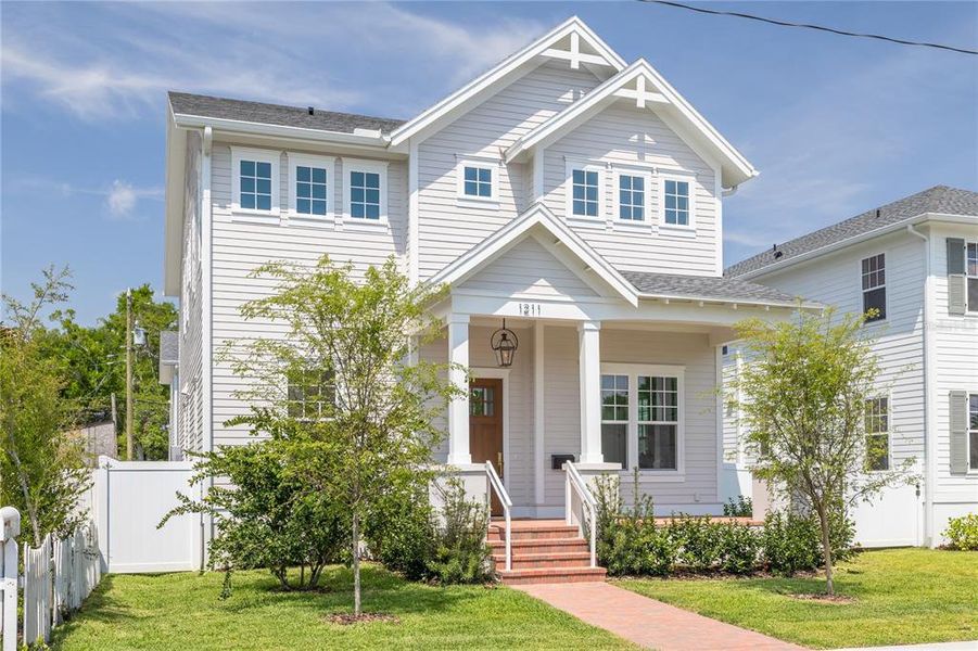 Front exterior of a new home in , St. Petersburg, FL, highlighting curb appeal (Image 24).