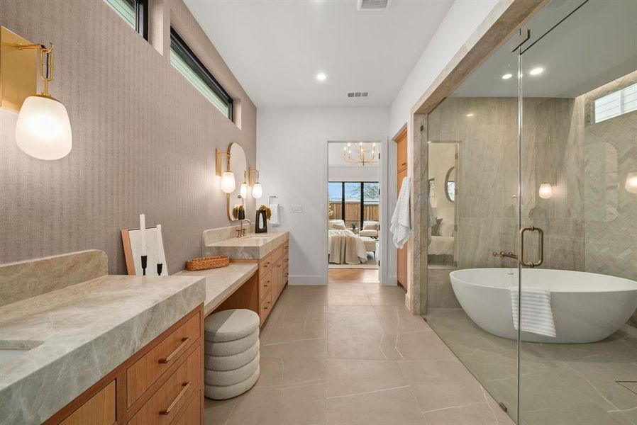 Full bathroom featuring ensuite bath, a freestanding tub, vanity, and a shower stall Full bathroom featuring ensuite bath, a freestanding tub, vanity, and a shower stall