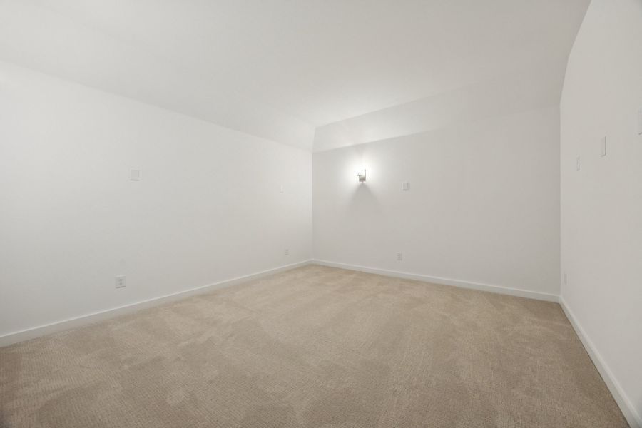 Media Room in the Monet II home plan by Trophy Signature Homes – REPRESENTATIVE PHOTO