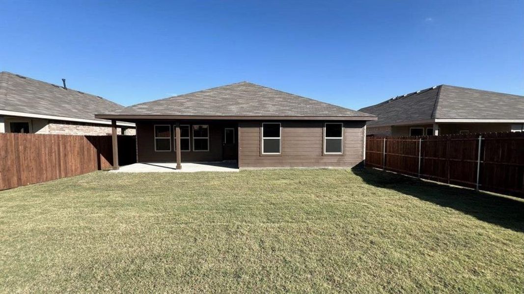 Rear Elevation & Backyard -All Home and community information, including pricing, included features, terms, availability and amenities, are subject to change at any time without notice or obligation. All Drawings, pictures, photographs, video, square footages, floor plans, elevations, features, colors and sizes are approximate for illustration purposes only and will vary from the homes as built.