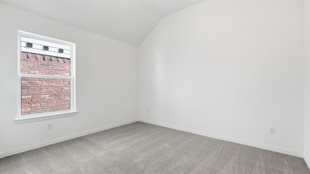 Room featuring neutral gray carpeting and white baseboards