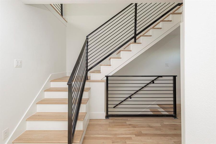 Staircase with wood finished floors