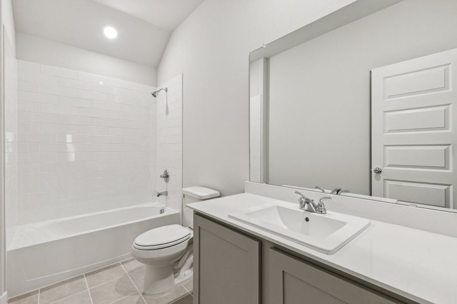 Bathroom in the Oscar home plan by Trophy Signature Homes – REPRESENTATIVE PHOTO