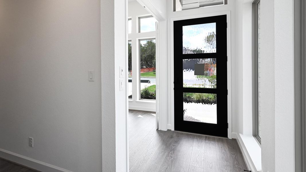 Entryway with dark wood-type flooring Entryway with dark wood-type flooring