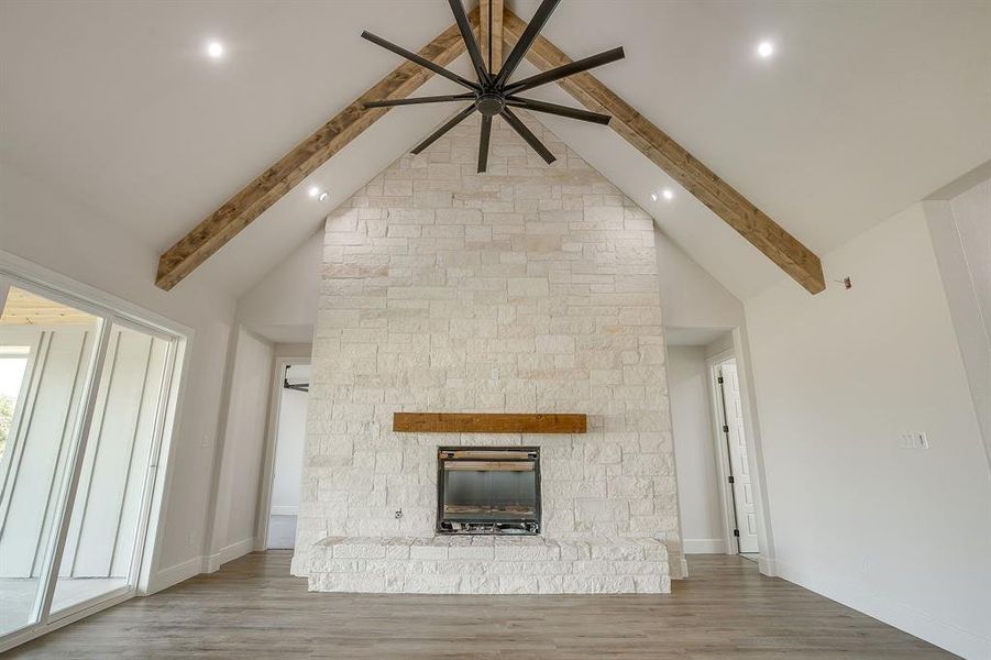 Floor to ceiling Austin stone propane fireplace.