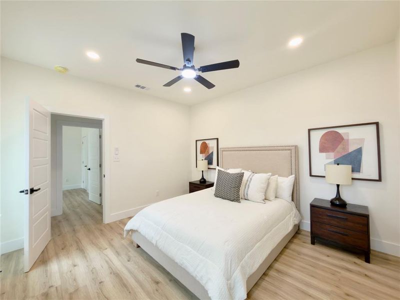 Light wood-finish flooring complements the neutral wall tones