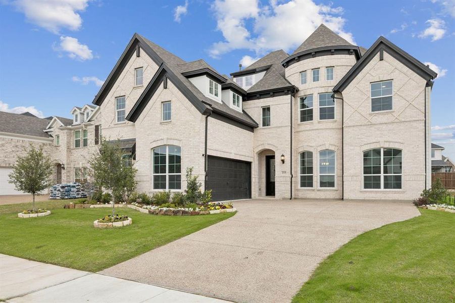 Front exterior of a new home in Dominion of Pleasant Valley, Wylie, TX, highlighting curb appeal (Image 1).