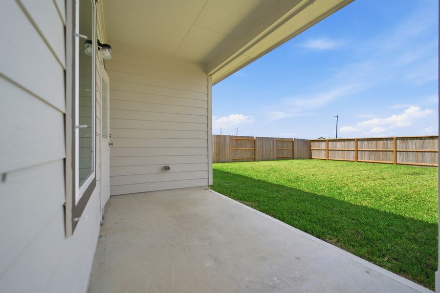 Exterior details and patio area of a home in Windrose Green, Angleton (Image 28).