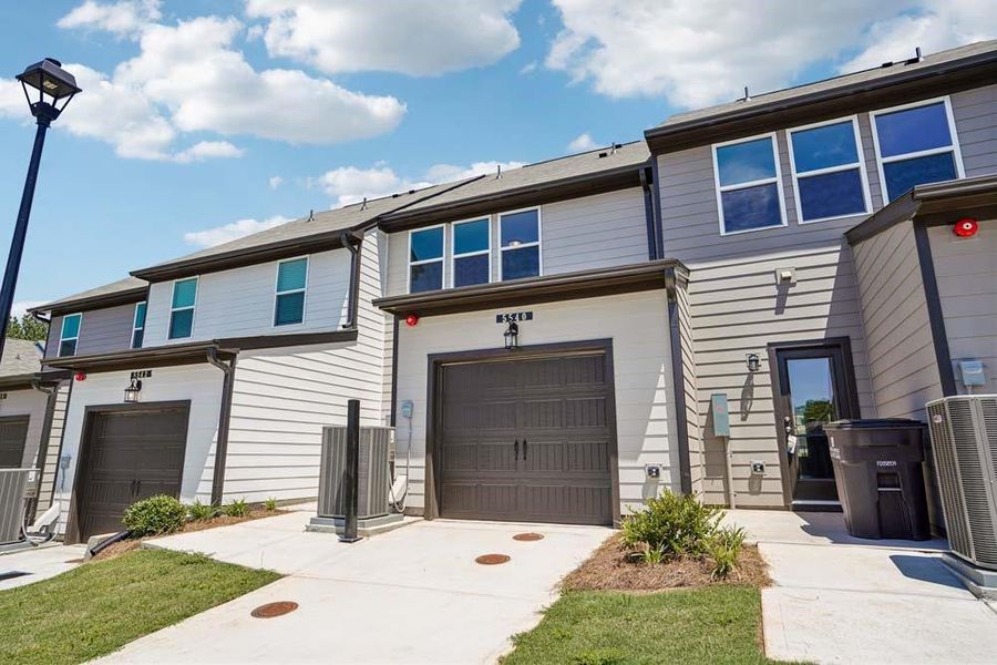 Front exterior of a new home in Laurelwood, Douglasville, GA, highlighting curb appeal (Image 19). Front exterior of a new home in Laurelwood, Douglasville, GA, highlighting curb appeal (Image 19).