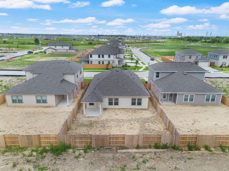 Front exterior of a new home in River Ranch Trails, Dayton, TX, highlighting curb appeal (Image 2).