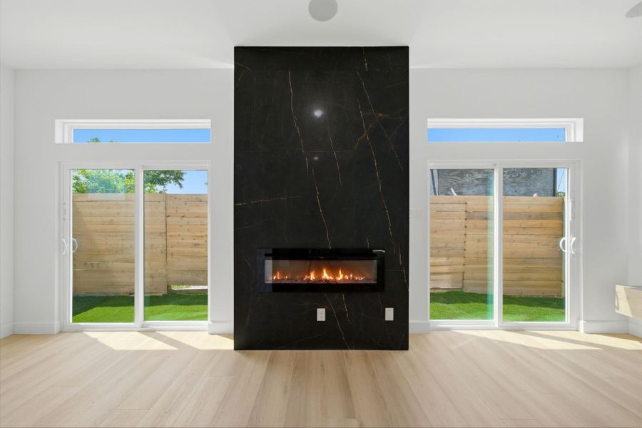 Electric fireplace, and windows placed to brong in light Electric fireplace, and windows placed to brong in light