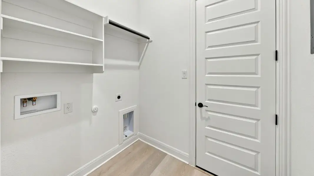 Furnished interior view inside a new home in Oaks at San Gabriel, Georgetown (Image 12).
