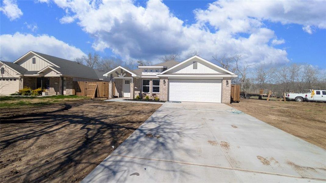 Front exterior of a new home in , Cleburne, TX, highlighting curb appeal (Image 17). Front exterior of a new home in , Cleburne, TX, highlighting curb appeal (Image 17).