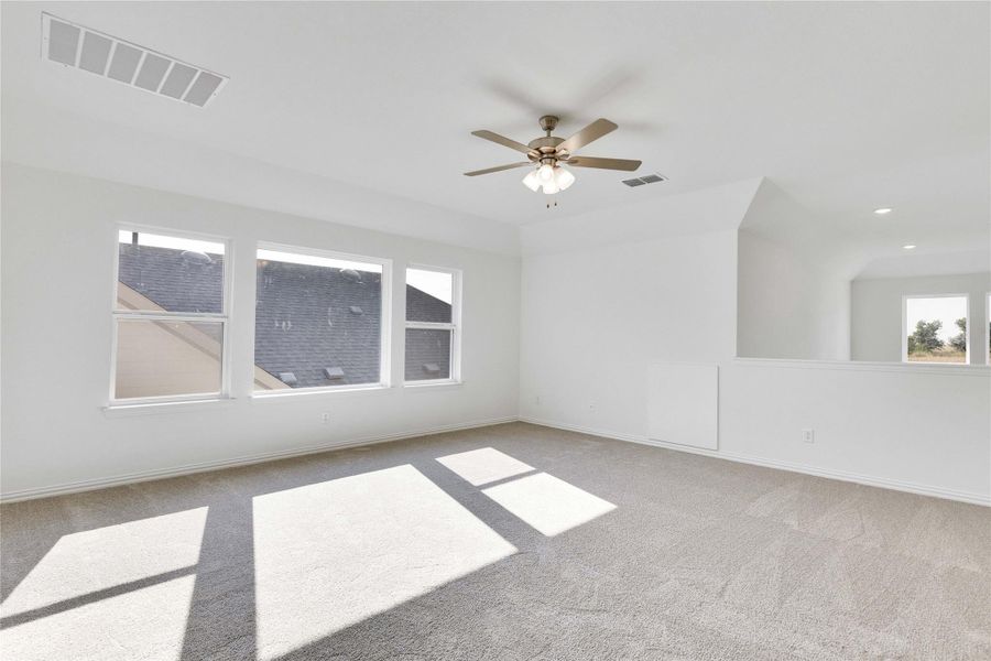 Spare room with light carpet, ceiling fan, and recessed lighting Spare room with light carpet, ceiling fan, and recessed lighting