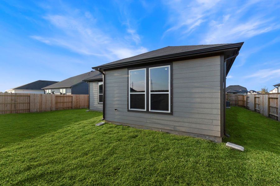 Exterior details and patio area of a home in Windcress, Baytown (Image 1).
