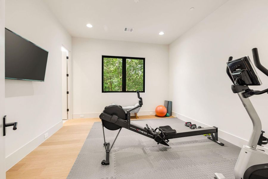 [SECONDARY BEDROOM] Elegant secondary bedroom suite with walk-in closet and en-suite bathroom. Used as a work out space.