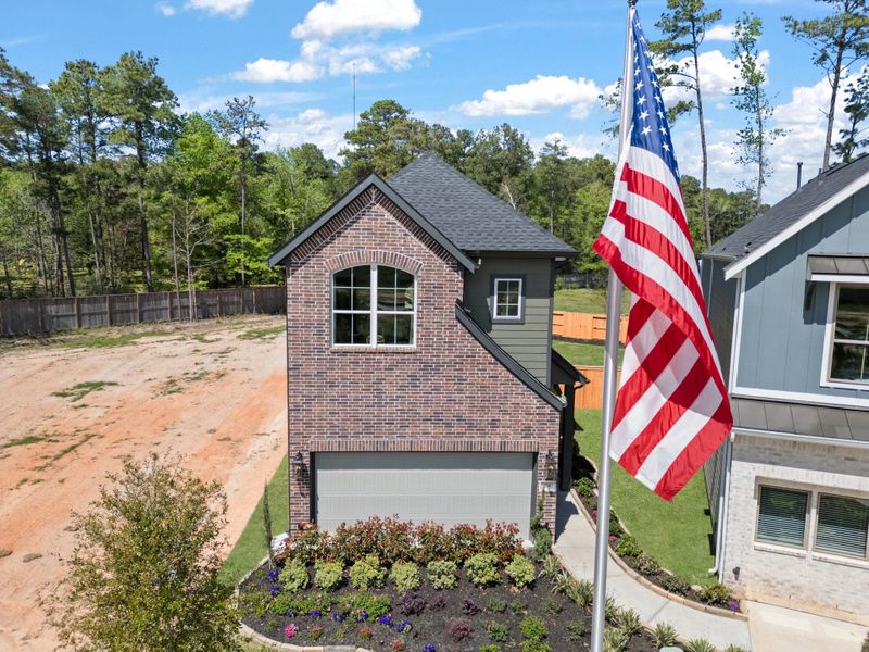 Front exterior of a new home in Santa Rita Ranch, Liberty Hill, TX, highlighting curb appeal (Image 20).