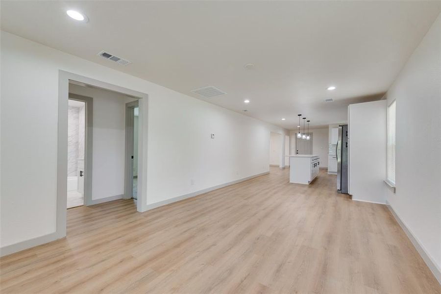 Unfurnished living room with light hardwood / wood-style floors