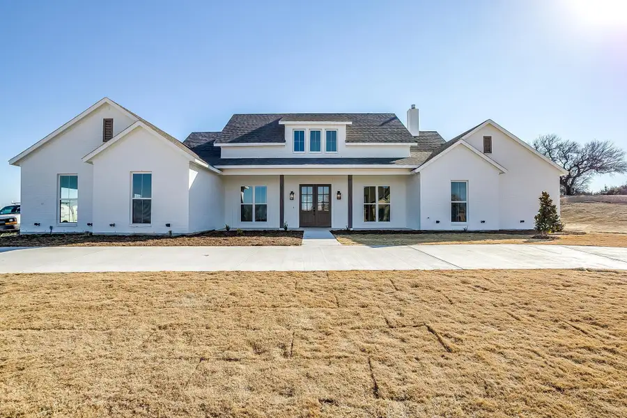 Representative exterior photo of a completed home built from the Pecan Grove by Trinity Classic Homes in The Reserve at Shadle, Poolville, TX (Image 2). Representative exterior photo of a completed home built from the Pecan Grove by Trinity Classic Homes in The Reserve at Shadle, Poolville, TX (Image 2).