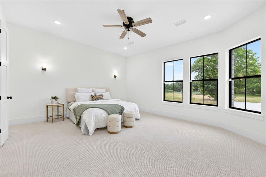 Large, Primary bedroom located in the rear of the home separate from remaining bedrooms
