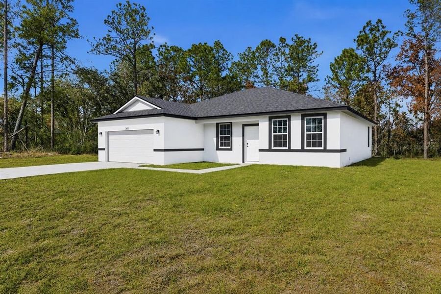 Front exterior of a new home in , Ocala, FL, highlighting curb appeal (Image 1). Front exterior of a new home in , Ocala, FL, highlighting curb appeal (Image 1).