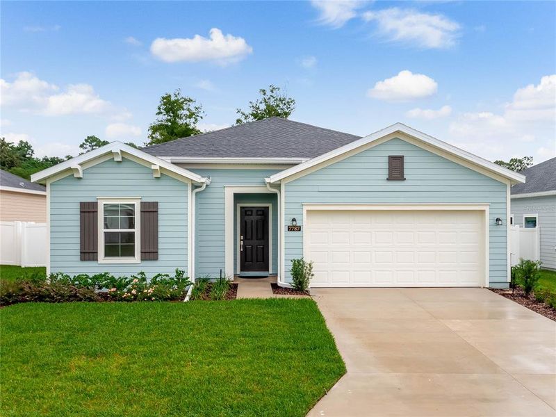 Front exterior of a new home in Liberty Village: Liberty Village - Phase Two, Ocala, FL, highlighting curb appeal (Image 22). Front exterior of a new home in Liberty Village: Liberty Village - Phase Two, Ocala, FL, highlighting curb appeal (Image 22).