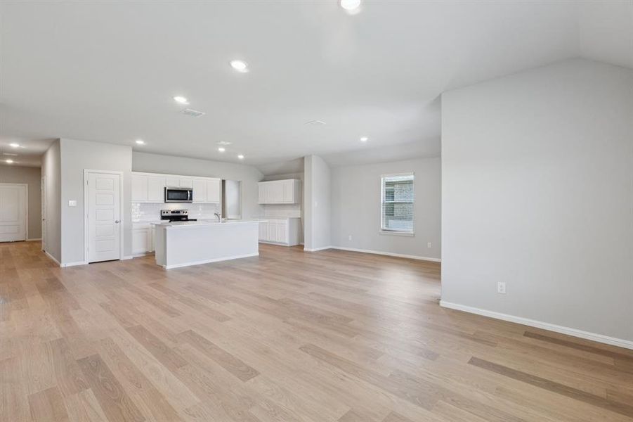 Open Floor Plan in the Harrison home plan by Trophy Signature Homes – REPRESENTATIVE PHOTO Open Floor Plan in the Harrison home plan by Trophy Signature Homes – REPRESENTATIVE PHOTO