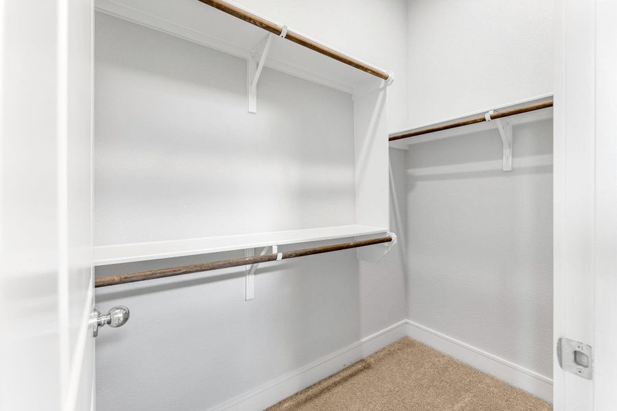 Ample shelving and hanging space offer organized storage in this well-appointed closet. Ample shelving and hanging space offer organized storage in this well-appointed closet.