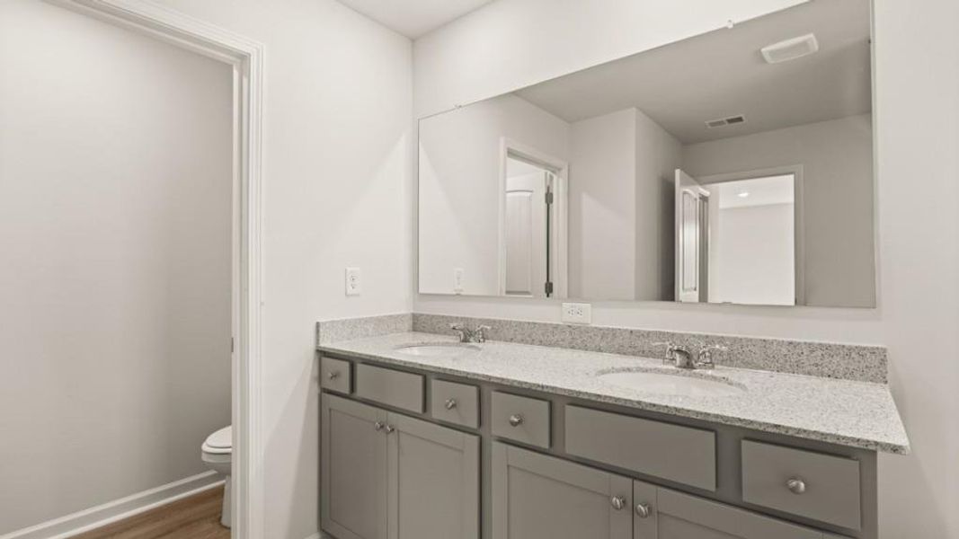 Furnished interior view inside a new home in Fairway 17 at Mirror Lake, Villa Rica (Image 9).