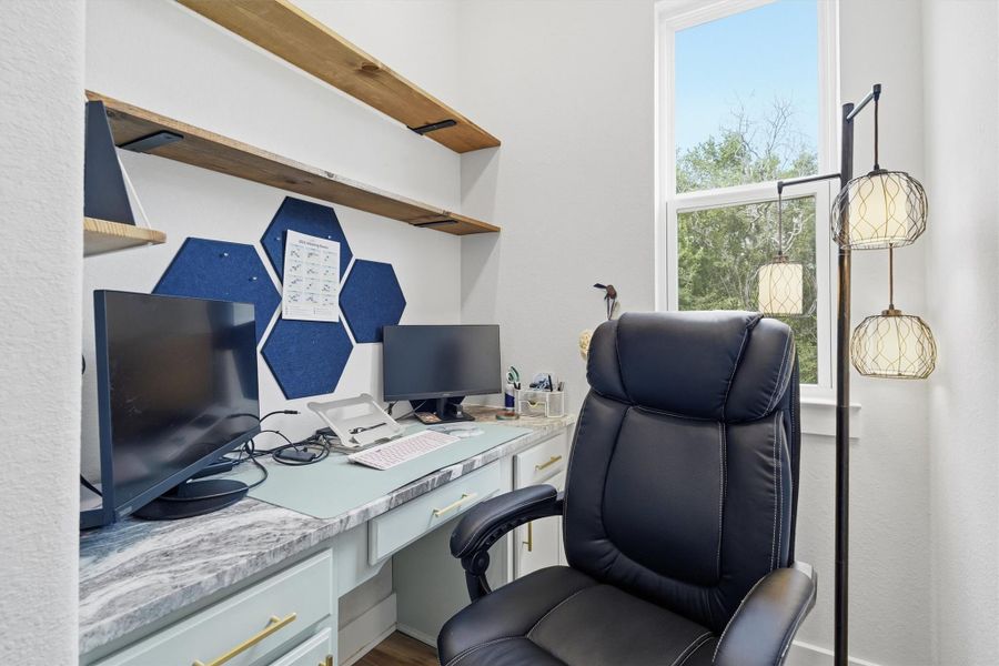 Office area with built ins, window overlooking side yard. Office area with built ins, window overlooking side yard.