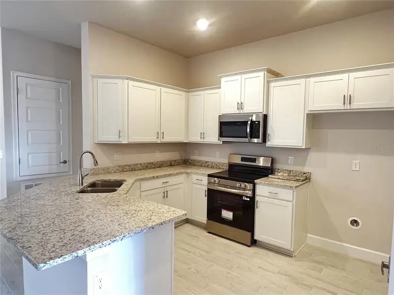 Furnished interior view inside a new home in , Dade City (Image 5).