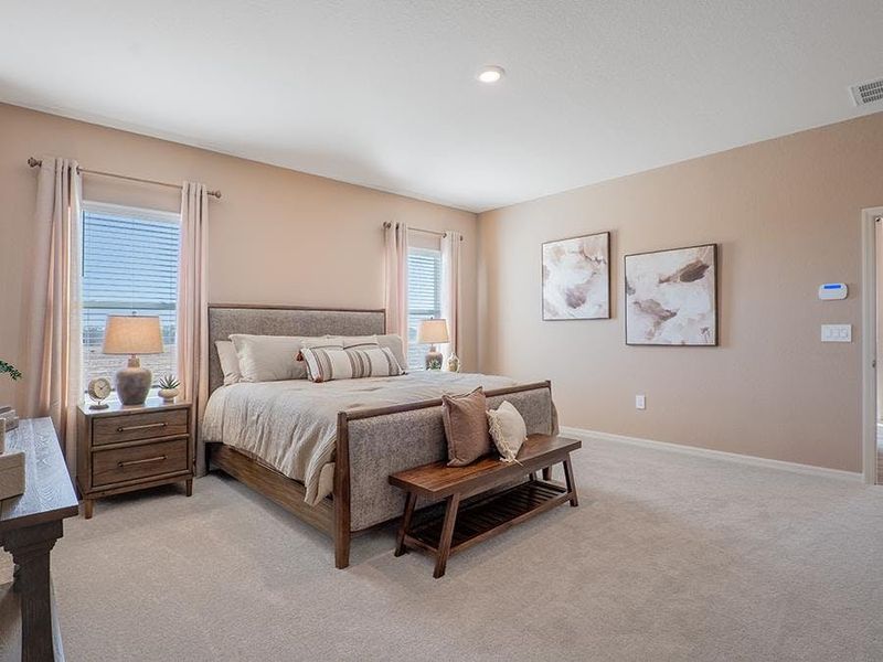Relax and unwind in your spacious owner`s suite - Monroe by Highland Homes