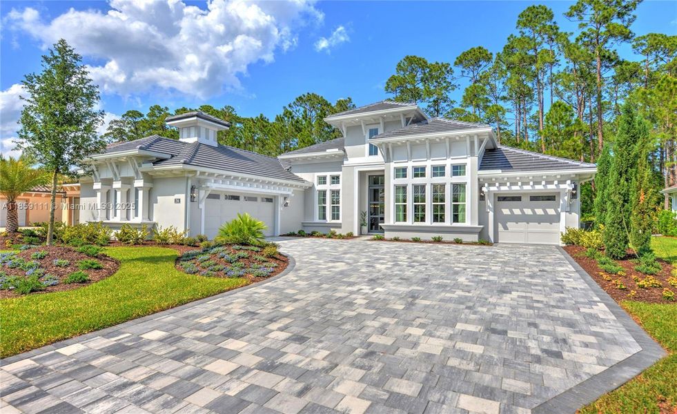 Front exterior of a new home in Westlake Executive, Ormond Beach, FL, highlighting curb appeal (Image 2).