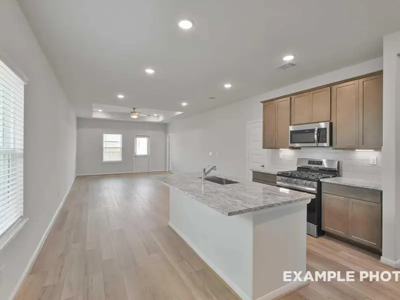 Furnished interior view inside a new home in Caney Creek Place, Conroe (Image 5).