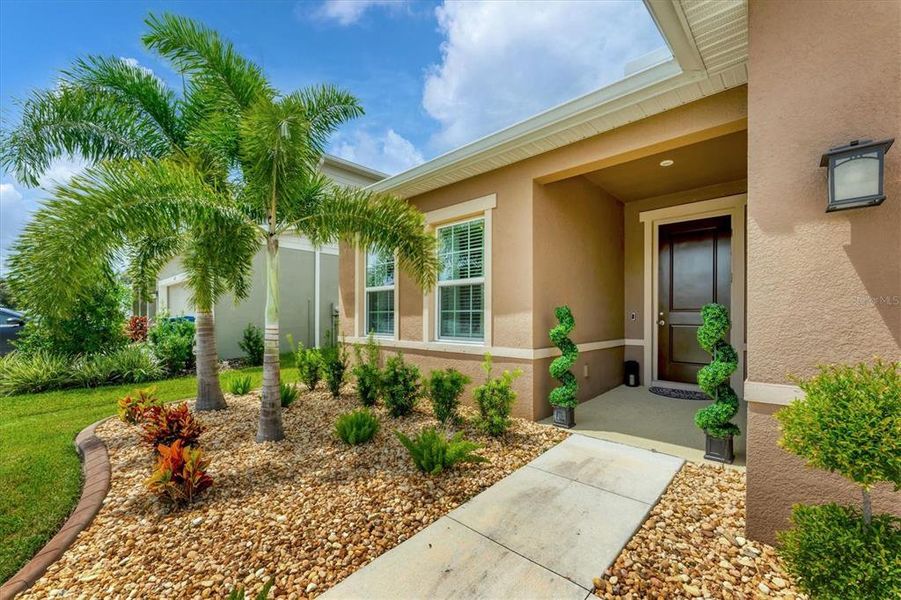 Front exterior of a new home in , Parrish, FL, highlighting curb appeal (Image 22).