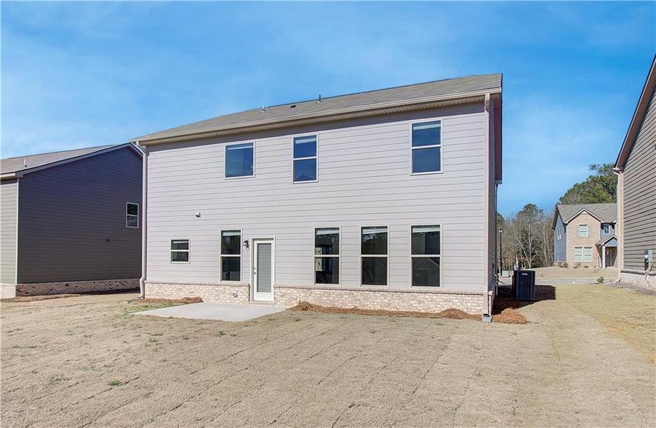 Front exterior of a new home in Cedar Grove Commons, Conley, GA, highlighting curb appeal (Image 13). Front exterior of a new home in Cedar Grove Commons, Conley, GA, highlighting curb appeal (Image 13).