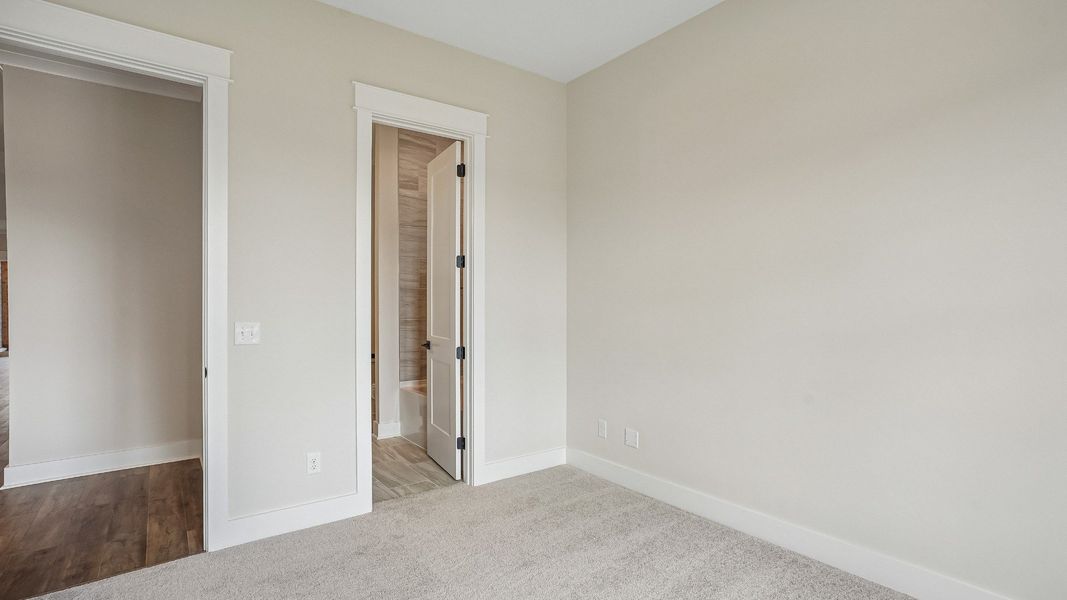 Guest bedroom at the front of the home with en-suite bathroom