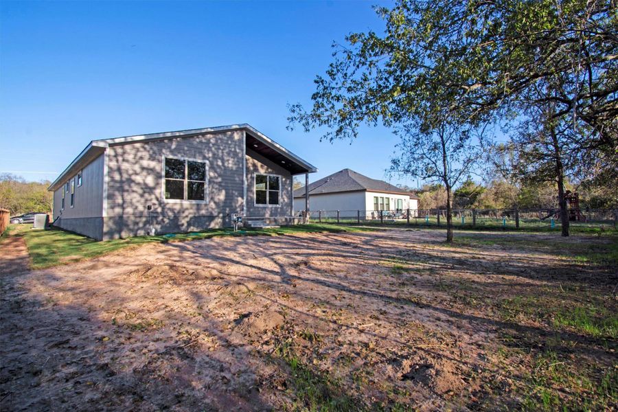 Exterior details and patio area of a home in , Bastrop (Image 25).