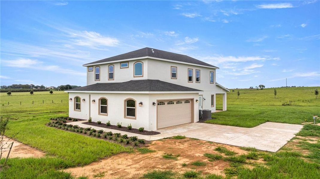 Front exterior of a new home in , Morriston, FL, highlighting curb appeal (Image 28). Front exterior of a new home in , Morriston, FL, highlighting curb appeal (Image 28).