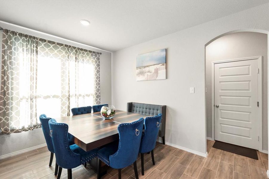 Dining area with wood-type flooring