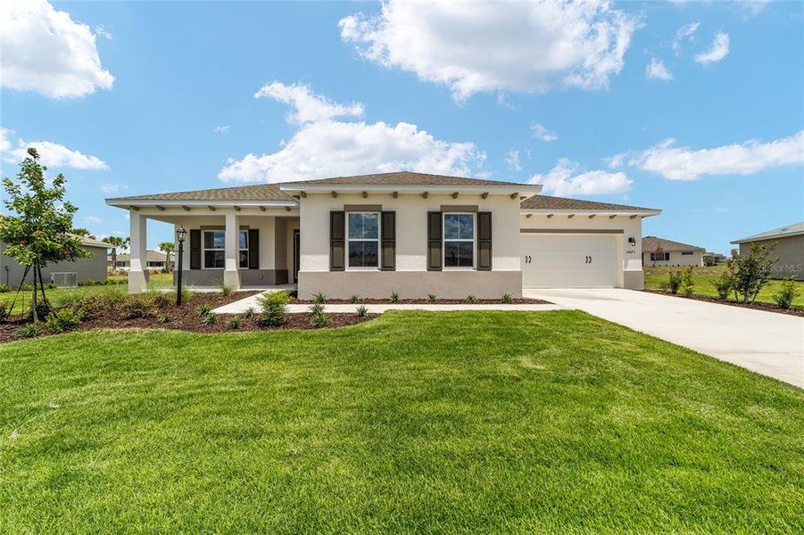Front exterior of a new home in , Ocala, FL, highlighting curb appeal (Image 1). Front exterior of a new home in , Ocala, FL, highlighting curb appeal (Image 1).
