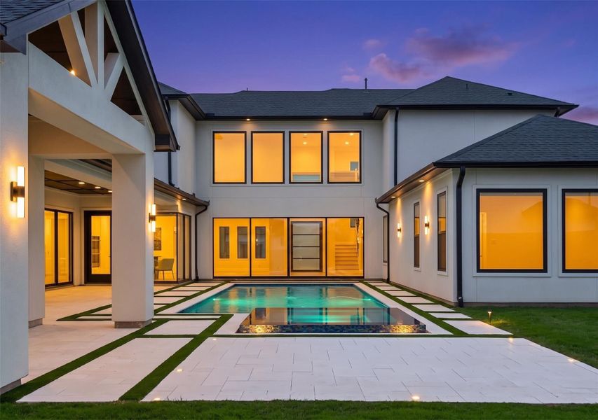 What a view! Clean architectural lines and a stunning resort-style pool create the ultimate private oasis! No expense was spared in the design of this extraordinary custom home.