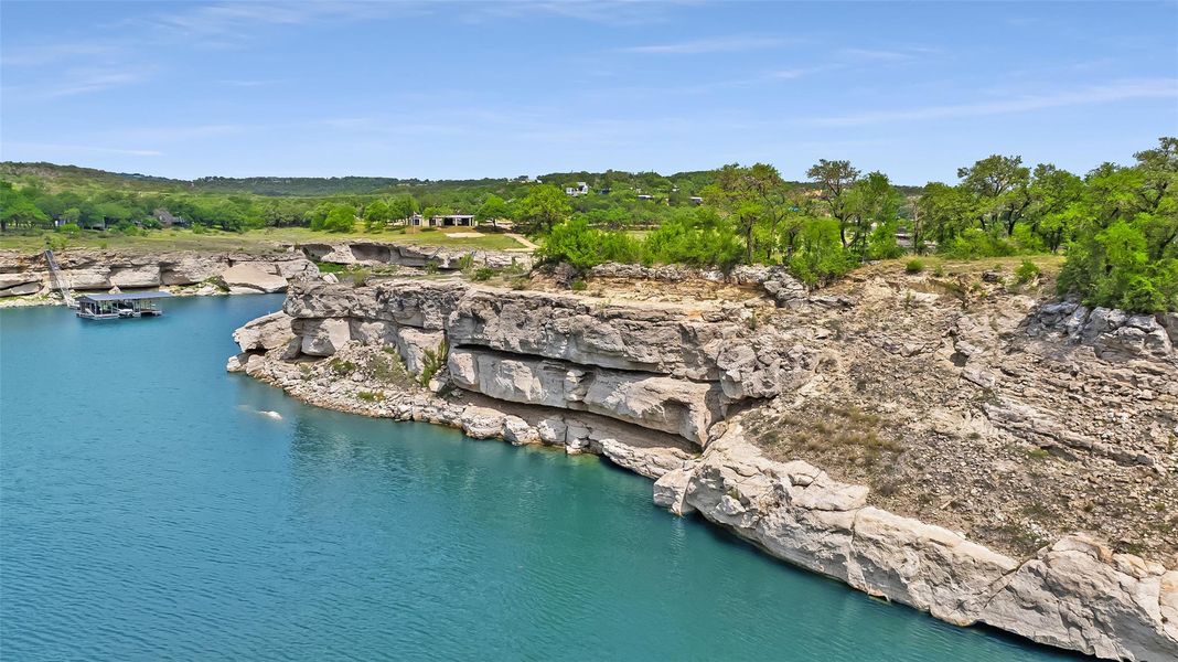 Aerial overview of property's location with a nearby body of water