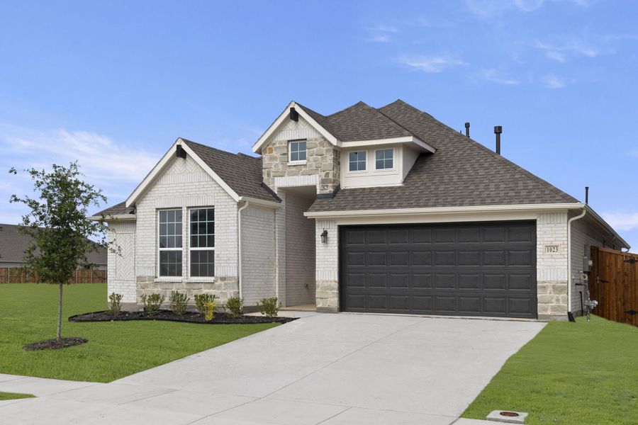 Front exterior of a new home in Timberbrook, Justin, TX, highlighting curb appeal (Image 2). Front exterior of a new home in Timberbrook, Justin, TX, highlighting curb appeal (Image 2).