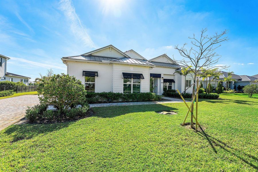 Front exterior of a new home in Bridgewater, Jupiter, FL, highlighting curb appeal (Image 2). Front exterior of a new home in Bridgewater, Jupiter, FL, highlighting curb appeal (Image 2).