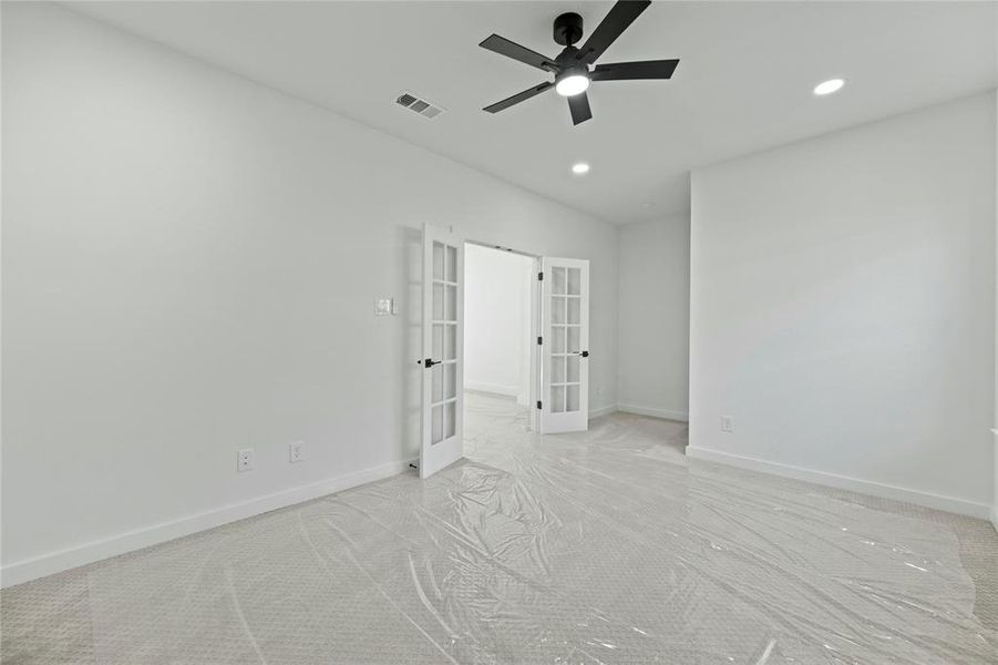 Unfurnished bedroom featuring french doors, recessed lighting, carpet, and ceiling fan Unfurnished bedroom featuring french doors, recessed lighting, carpet, and ceiling fan