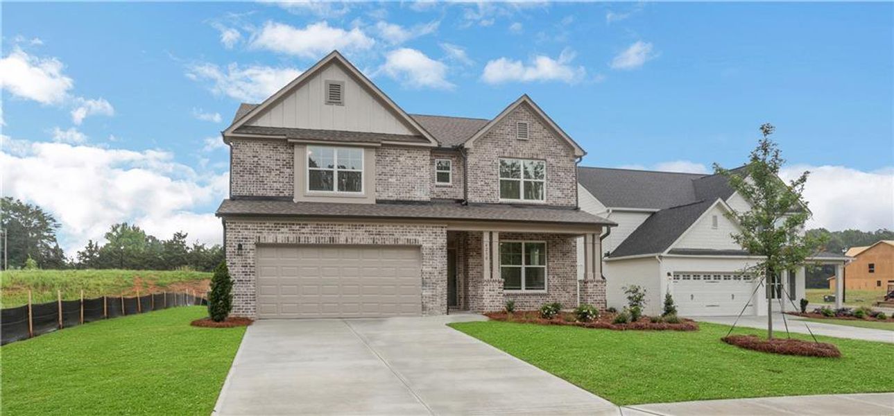 Front exterior of a new home in , Loganville, GA, highlighting curb appeal (Image 24).