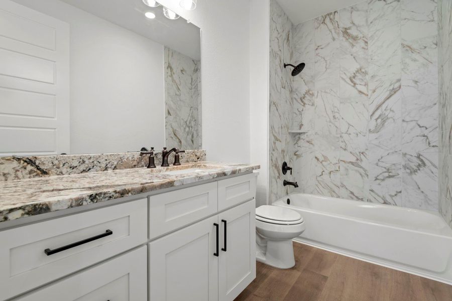 Full bathroom located downstairs for guests. Full bathroom located downstairs for guests.